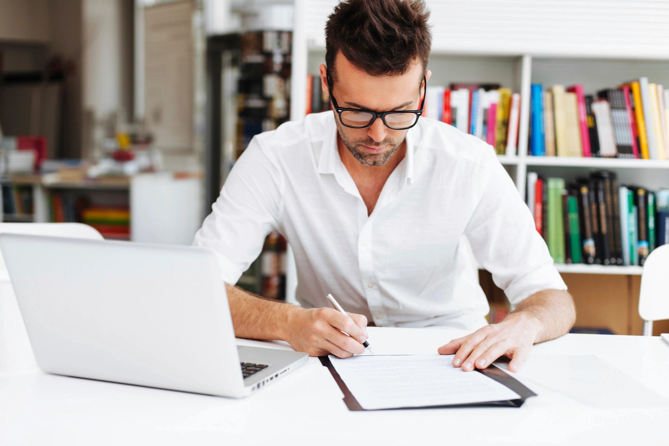 A man writing an appointment